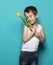 Smiling small boy with yellow tulip