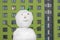 Smiling snowman face in the city