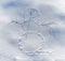 A smiling snowman painted on snow