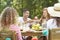 Smiling spanish man sharing food with happy woman during meeting