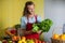 Smiling staff looking at leafy vegetables at counter