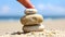 Smiling Stone Balanced on a Pebble Stack by the Beach, Simple Pleasures of Nature. Conceptual Image Promoting Positivity