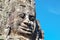 A smiling stone face, part of Cambodia\\\'s ancient sculptural heritage
