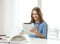 Smiling student girl with tablet pc and books