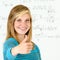 Smiling student girl thumb up mathematics board