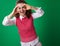 Smiling student woman looking through binocular shaped hands