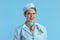 smiling stylish flight attendant woman on blue