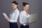 smiling stylish flight attendant women isolated on grey