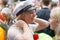 Smiling swedish student girl wearing white graduation cap after