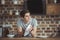 smiling teen boy cleaning dinnerware with towel