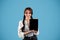 Smiling teen european girl student with pigtails show tablet with blank screen