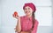 smiling teen girl in chef uniform cooking vegetables, tomato