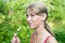 Smiling teen girl with chocolate popsicle ice cream in the hand