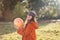 Smiling teen girl with pumpkin in the hands