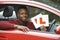 Smiling Teenage Boy In Car Passing Driving Exam