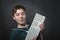 Smiling teenage boy with computer keyboard