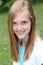 Smiling teenage girl with braces on her teeth