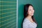 Smiling teenage girl in school looking up