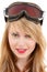 Smiling teenage girl in snowboard goggles