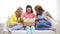 Smiling teenage girls opening cardboard box