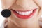 Smiling telemarketing operator with microphone