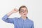 Smiling tennager with magnifying glass on white background. Curious Teenager with Magnifying Glass Isolated on the White