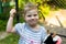 Smiling toddler little blond girl with plaits close up photo