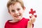 Smiling toothless boy finding special jigsaw for growing up idea