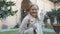 Smiling traveler woman smile at camera enjoying panoramic view of garden of the Palazzo Medici Riccardi (Palazzo