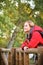 Smiling trekker contemplating views in the forest.