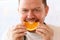 Smiling Vegan Chef Eating Tropical Fruit Portrait