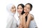 Smiling a veiled girl and two asian young girl laughing and hugging