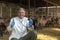 Smiling Veterinarian With Stethoscope at Goat Farm - Goat Farming