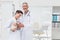 Smiling veterinarians holding cat