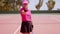 Smiling victorious young woman tennis player