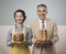 Smiling vintage couple with cakes