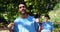 Smiling volunteer pointing at his t-shirt 4k