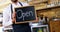 Smiling waiter holding open sign board