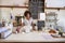 Smiling waitress behind the counter at a coffee shop