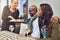 Smiling waitress serving a couple their food