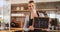 Smiling waitress showing slate with open sign