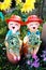 Smiling welcome boy and girl clay dolls