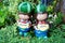 Smiling welcome boy and girl clay dolls