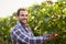 Smiling winemaker in the vineyard