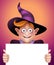 Smiling wizard boy holding blank message card, Halloween banner illustration