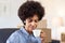Smiling woman with Afro hairstyle in office