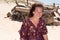 Smiling woman on the beach happy on sand seacoast vacation