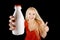 Smiling woman with bottle of milk