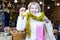 Smiling woman is buying toys for X-mas tree in the market