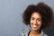 Smiling woman with a curly afro hairstyle